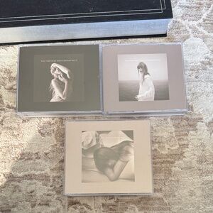 Taylor Swift The Tortured Poets Department CD collection.